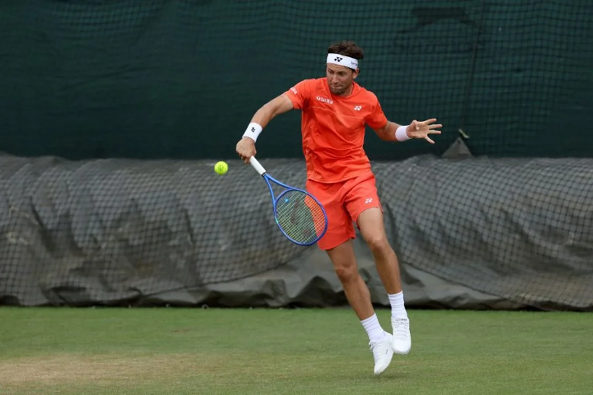 Norway's Casper Ruud returns to his traning partner at the practice courts at The All England Lawn Tennis and Croquet Club in Wimbledon, southwest London, on June 28, 2026, ahead of the 2026 Wimbledon Championships.  Adrian Dennis / AFP