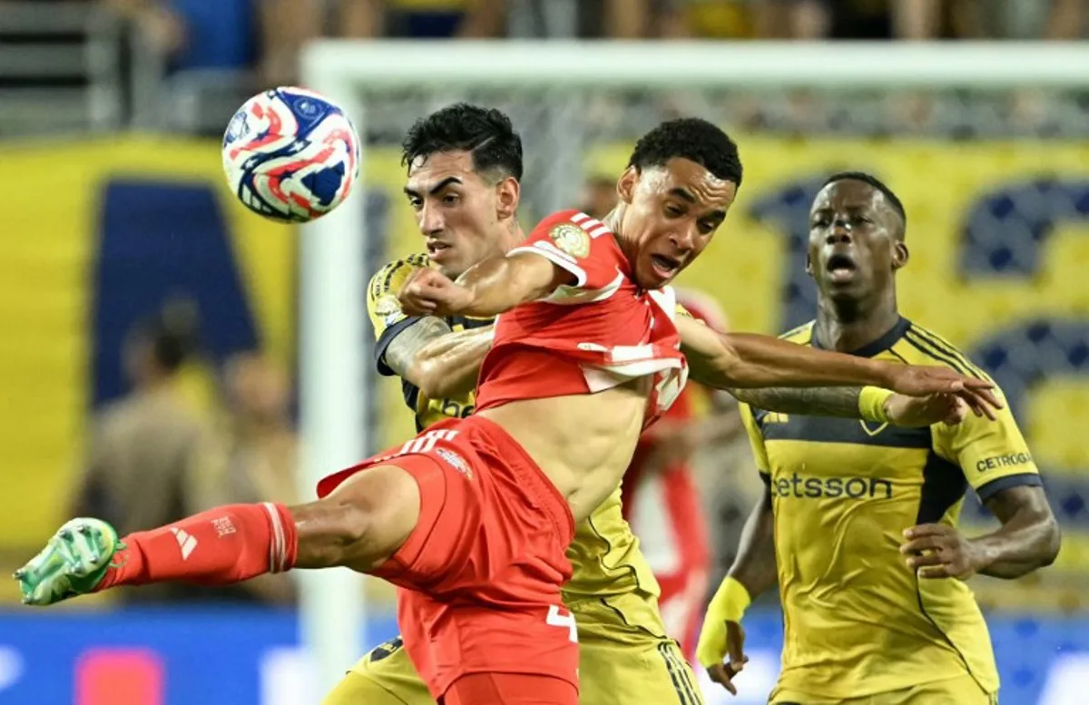 Boca Juniors' Argentine defender #40 Lautaro Di Lollo and Bayern Munich's German midfielder #42 Jamal Musiala fight for the ball during the FIFA Club World Cup 2025 Group C football match between Germany's Bayern Munich and Argentina's Boca Juniors at the Hard Rock stadium in Miami on June 20, 2025. PATRICIA DE MELO MOREIRA / AFP