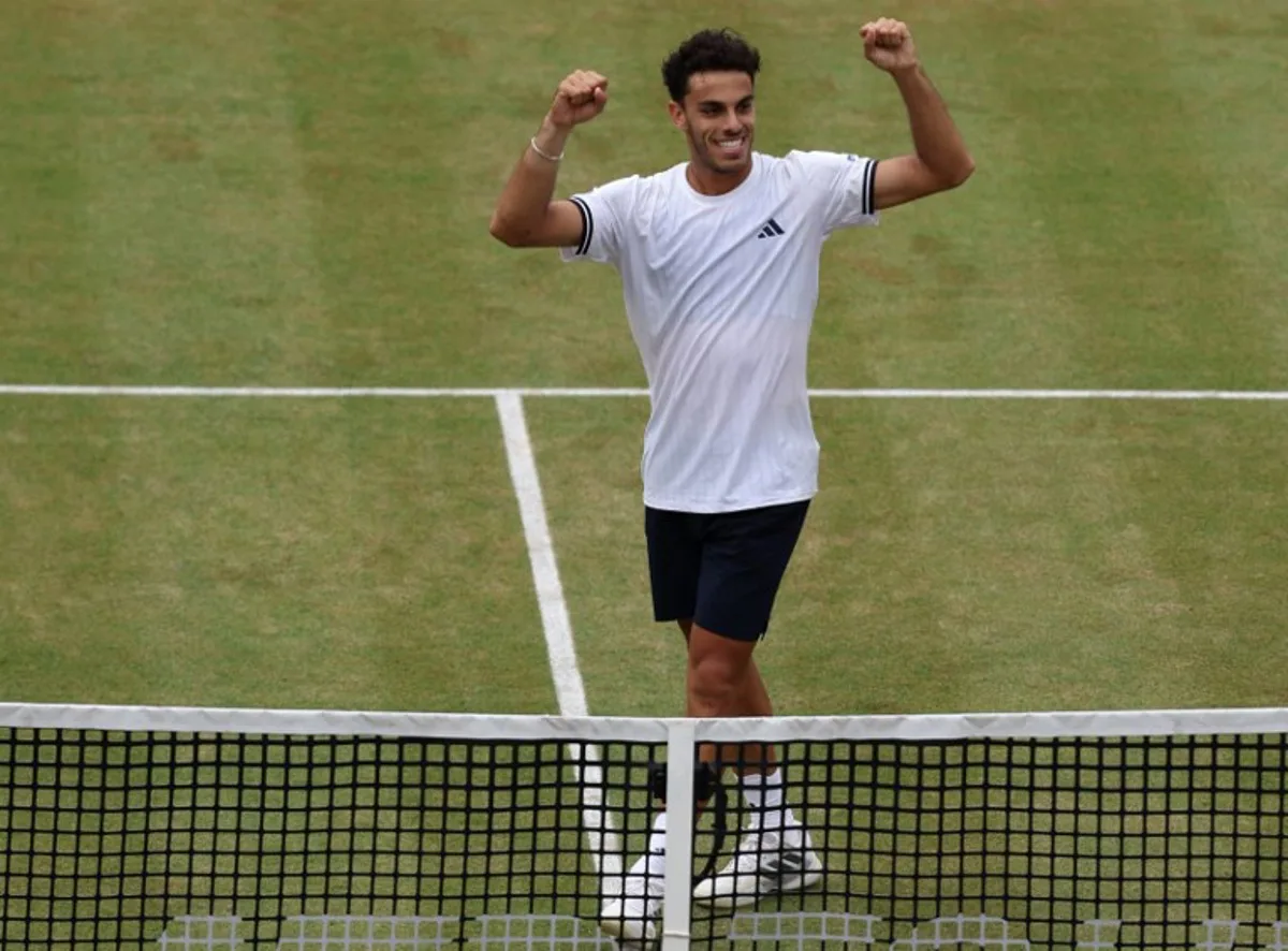 Argentina's Francisco Cerundolo celebrates winning against US player Brandon Nakashima during their men's singles semi-final tennis match on day six of the ATP HSBC Championships at Queen's Club in west London on June 20, 2026. Cerundolo won the match 6-7, 6-3, 6-4. Adrian Dennis / AFP