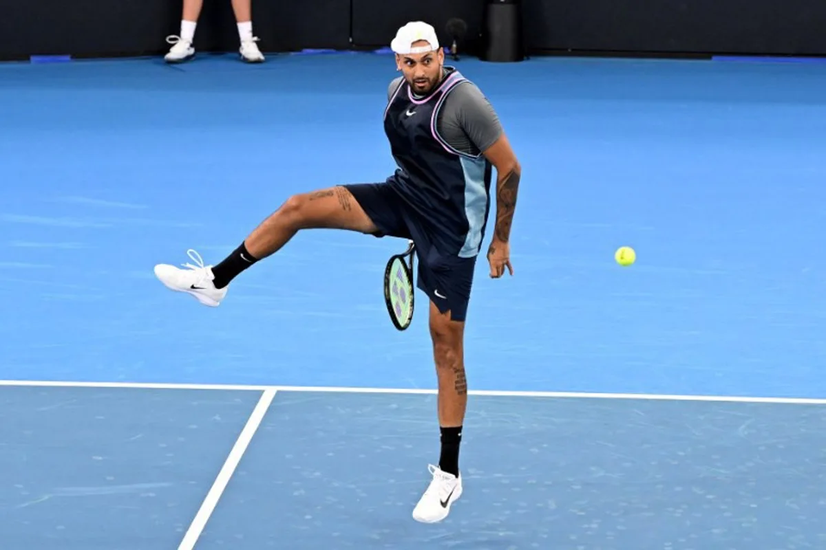 Nick Kyrgios of Australia plays a point during his men's doubles match against Michael Venus of New Zealand and Nikola Mektic of Croatia at the Brisbane International tennis tournament in Brisbane on January 1, 2025.  William WEST / AFP