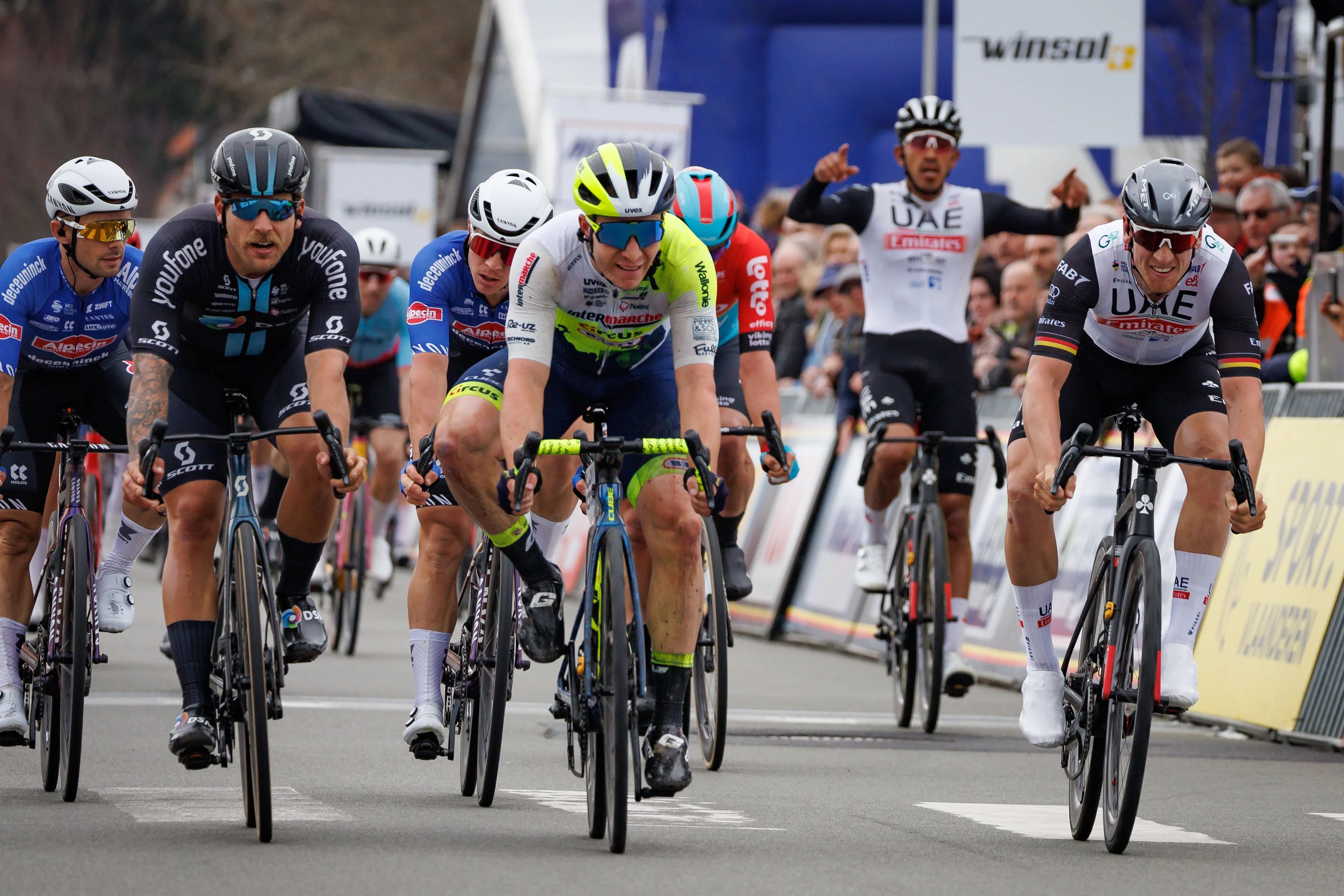 Belgian Gerben Thijssen of Intermarche-Circus-Wanty (C) wins before German Pascal Ackermann of UAE Team Emirates (R) and Australian Sam Welsford of Team DSM (L) the sprint at the finish of the 'Bredene Koksijde Classic' one day cycling race, 191,6 km from Bredene to Koksijde, Friday 17 March 2023. BELGA PHOTO KURT DESPLENTER