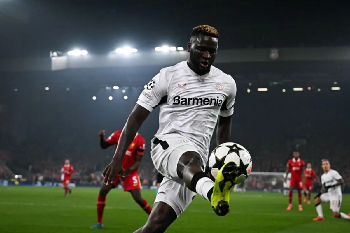 Bayer Leverkusen's Nigerian forward #22 Victor Boniface controls the ball during the UEFA Champions League football match between Liverpool and Bayer Leverkusen at Anfield stadium, in Liverpool, north west England, on November 5, 2024.  Paul ELLIS / AFP