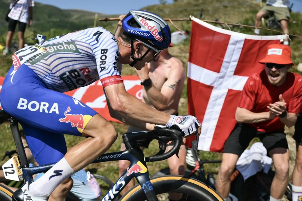 Red Bull - BORA - hansgrohe team's German rider Florian Lipowitz cycles in the ascent of Hautacam during the 12th stage of the 112th edition of the Tour de France cycling race, 180.6 km between Auch and Hautacam, in the Pyrenees mountains of southwestern France, on July 17, 2025. Marco BERTORELLO / AFP