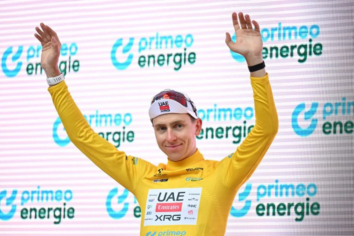 UAE Team Emirates-XRG's Slovenian rider Tadej Pogacar wearing the overall leader yellow jersey celebrates during the podium ceremony of the third stage, 157,4 km from Bad Ragaz to Bad Ragaz, of the Men's Tour of Switzerland (Tour de Suisse) cycling race in Bad Ragaz on June 19, 2026. HAROLD CUNNINGHAM / AFP