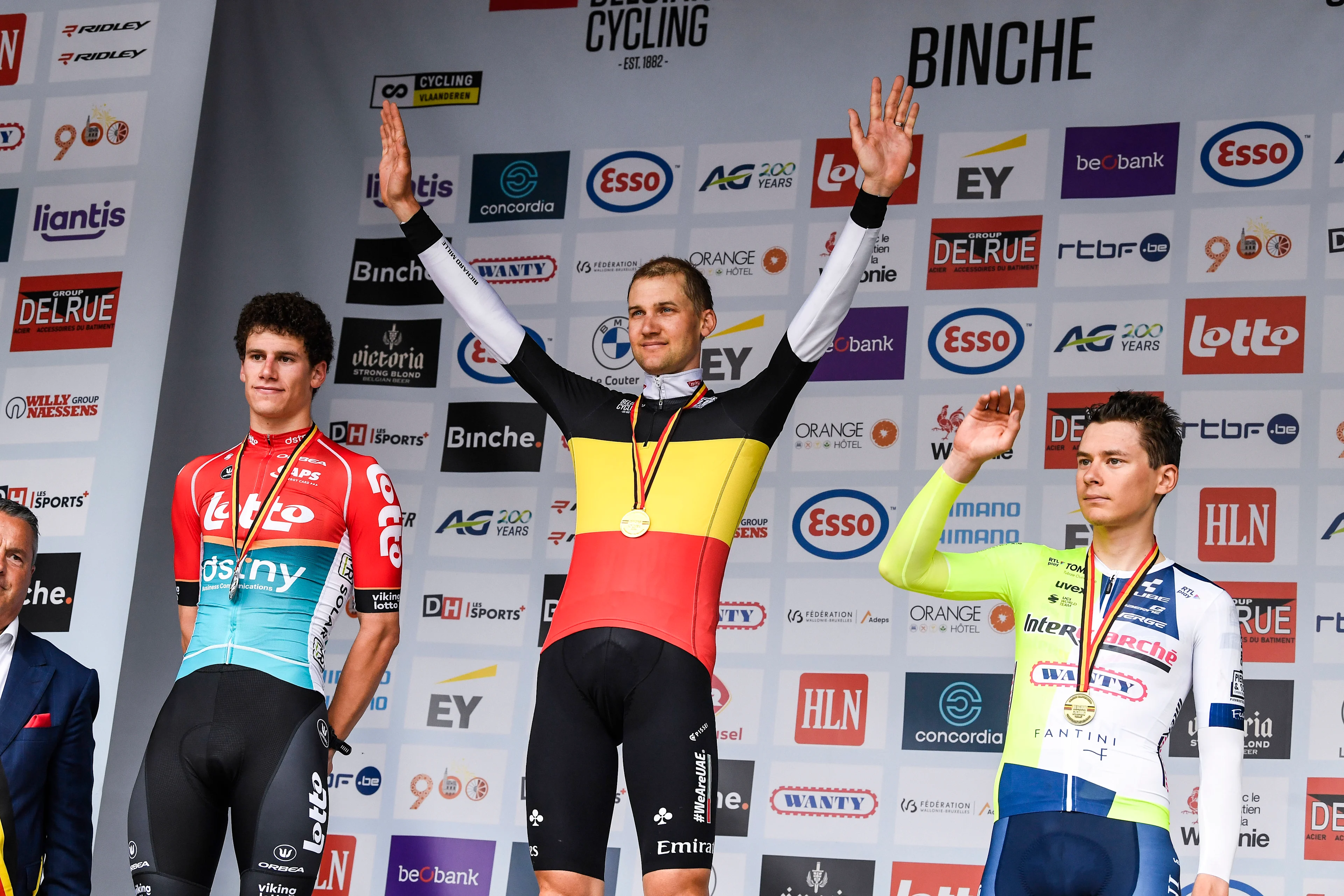 Belgian Alec Segaert of Lotto Dstny, Belgian Tim Wellens of UAE Team Emirates and Belgian Rune Herregodts of Intermarche-Wanty celebrate on the podium of the men's elite individual time trial of the Belgian Championships cycling, 38,5km, in Binche, on Thursday 20 June 2024. BELGA PHOTO TOM GOYVAERTS