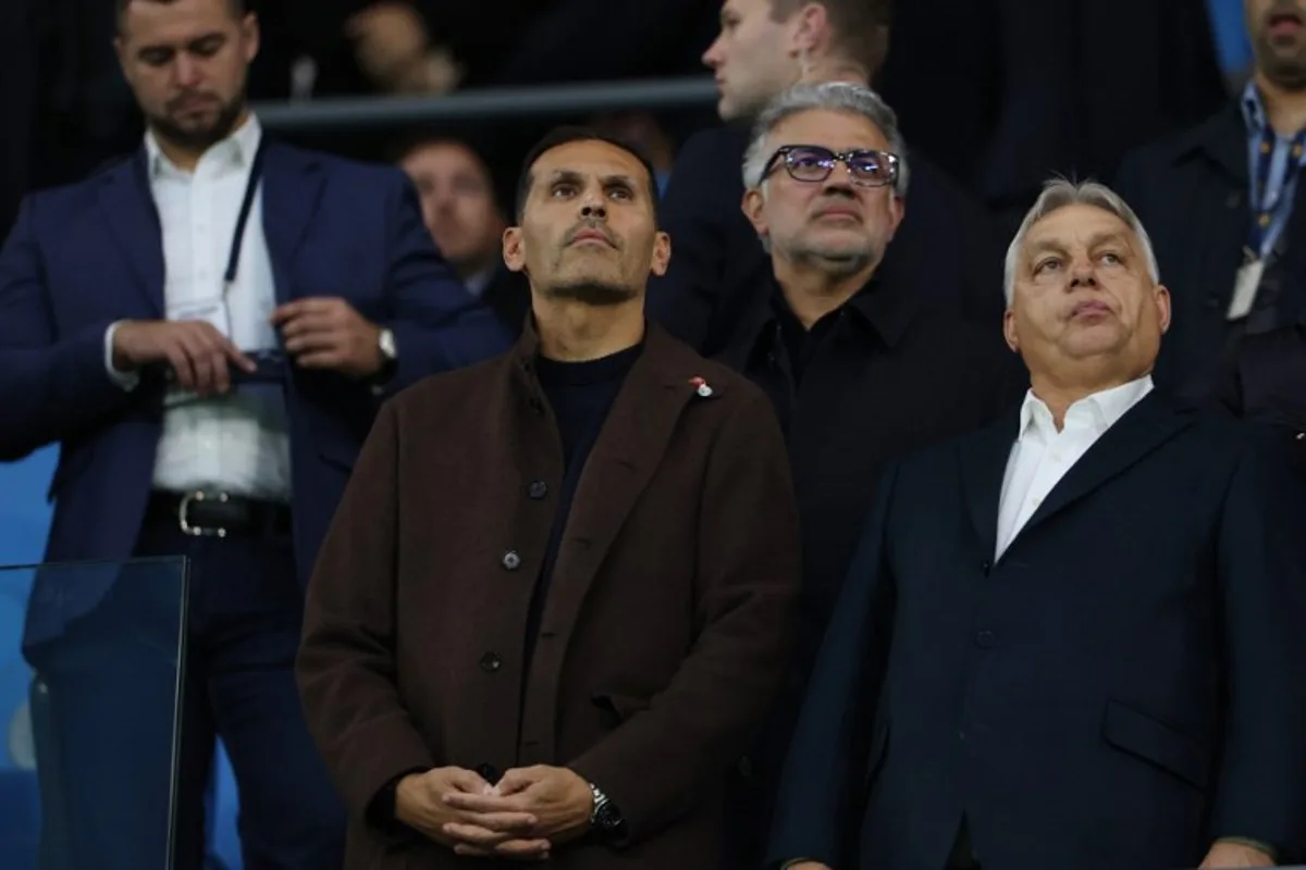 Manchester City's Emirati chairman Khaldoon al-Mubarak (L) and Hungary's Prime Minister Viktor Orban (R) watches from the stands during the English Premier League football match between Manchester City and Liverpool at the Etihad Stadium in Manchester, north west England, on November 9, 2025.  Darren Staples / AFP