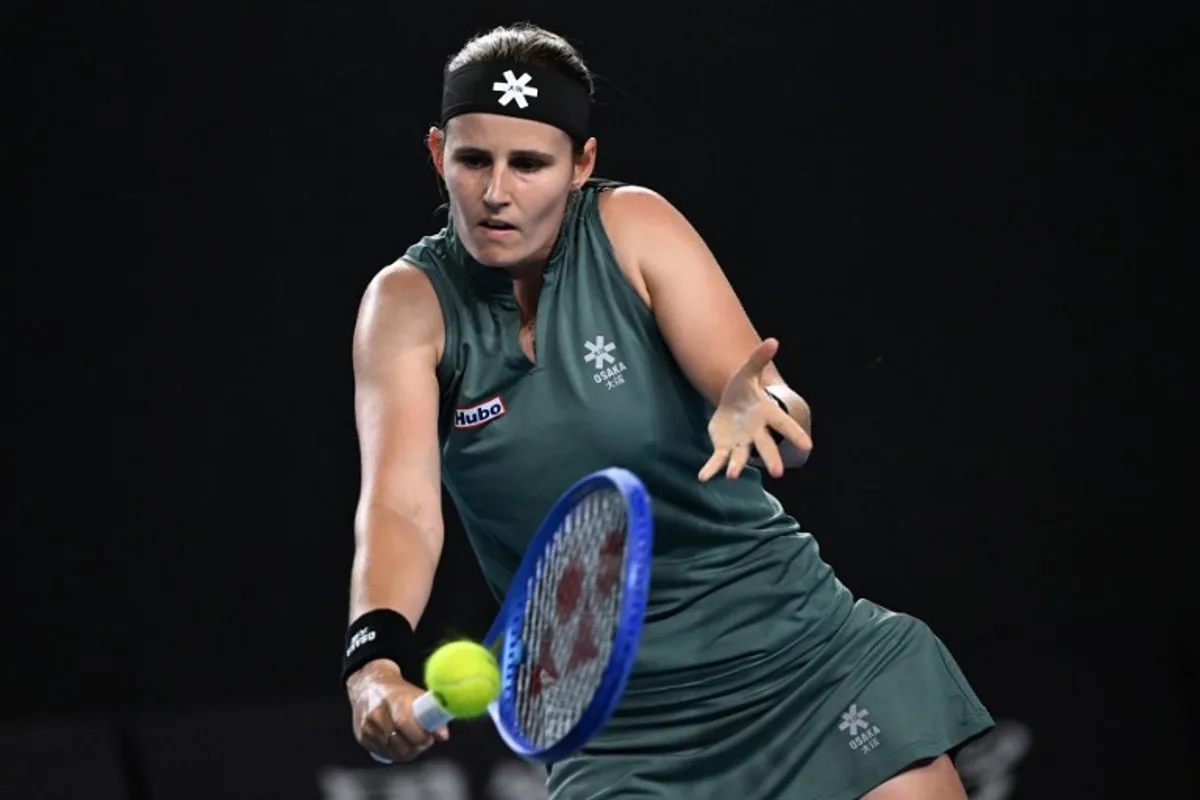 Belgium's Greet Minnen hits a shot against Australia's Destanee Aiava during their women's singles match on day two of the Australian Open tennis tournament in Melbourne on January 13, 2025.  WILLIAM WEST / AFP