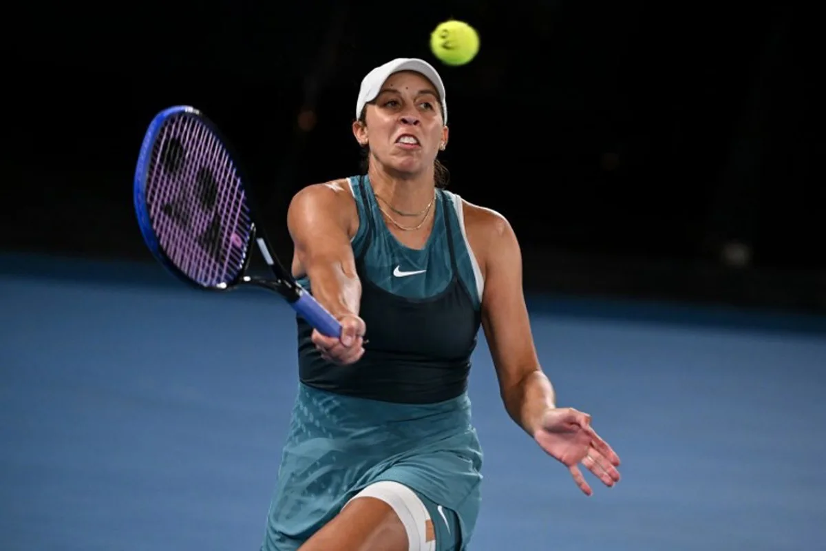 USA's Madison Keys hits a return against Belarus' Aryna Sabalenka during their women's singles final match on day fourteen of the Australian Open tennis tournament in Melbourne on January 25, 2025.  WILLIAM WEST / AFP