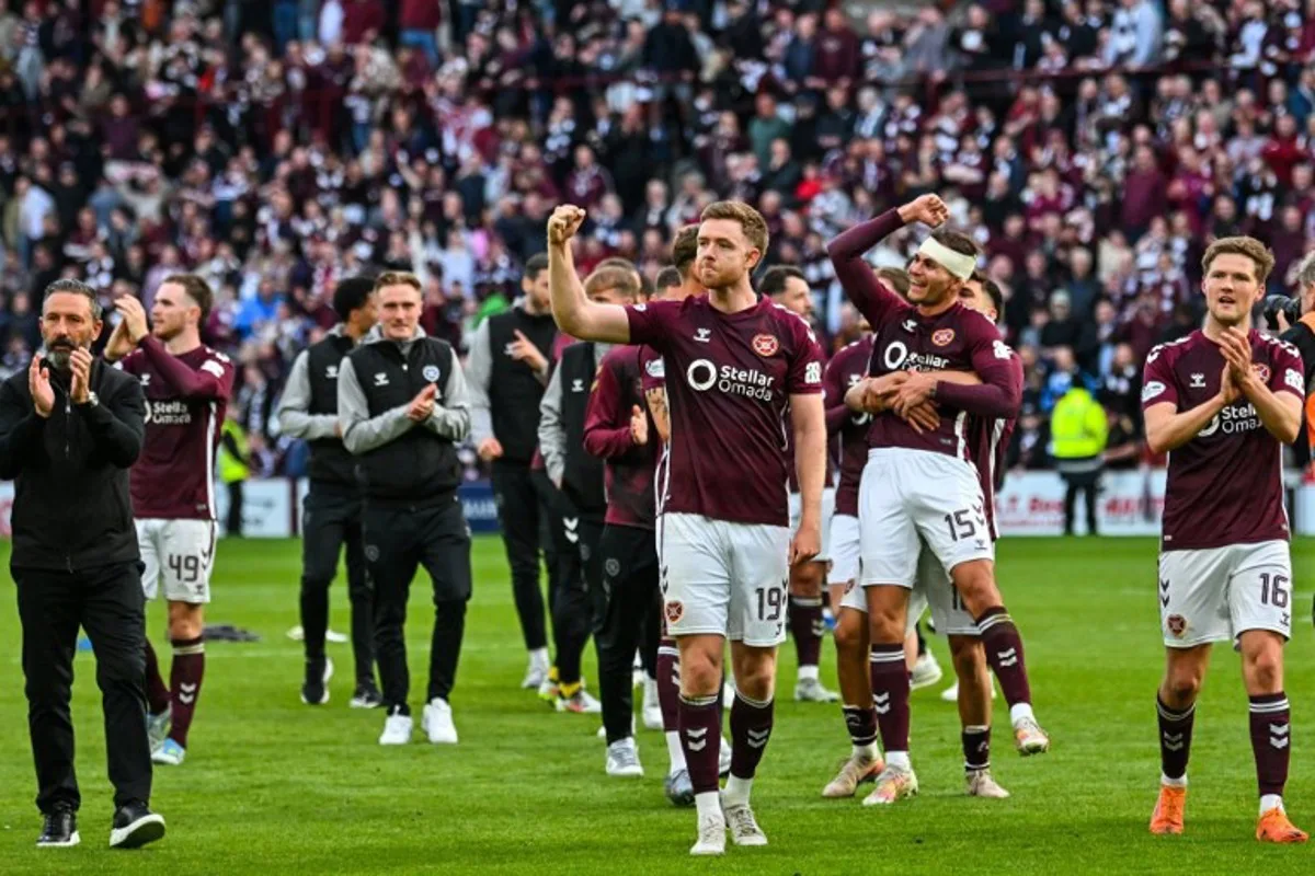 Players react after the final whistle in the Scottish Premiership football match between Hearts and Rangers at Tynecastle Stadium in Edinburgh on May 4, 2026. Hearts are hoping to become the first club other than Celtic and Rangers to win the Scottish crown since Aberdeen in 1985. ANDY BUCHANAN / AFP