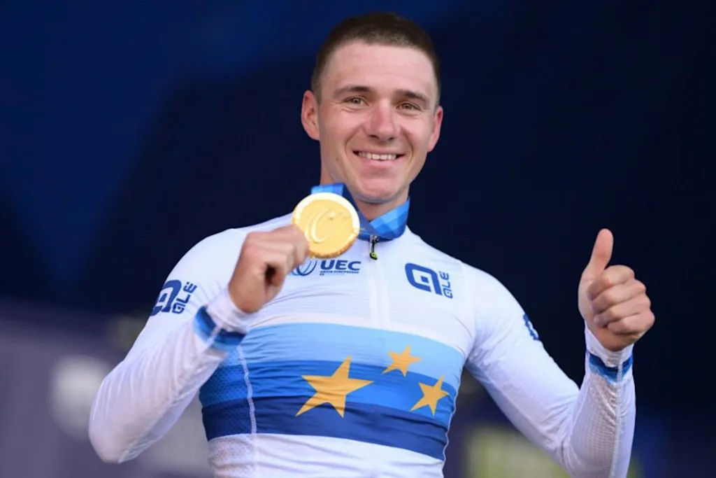 Gold medallist Belgium's rider Remco Evenepoel celebrates on the podium with his medal after winning the men's elite road race of the UEC European Road Cycling Championships in Sencur, near Ljubljana, Slovenia, on October 4, 2026.  JURE MAKOVEC / AFP
