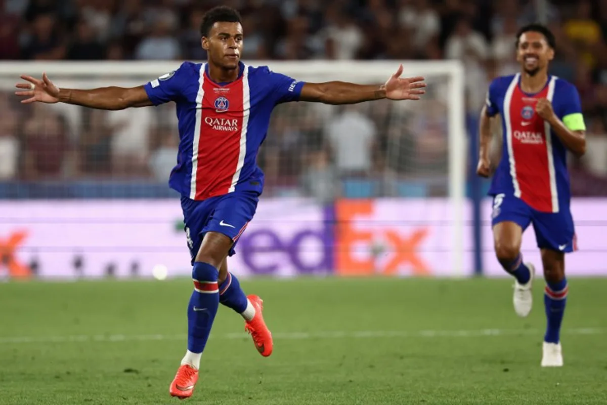 Paris Saint-Germain's French midfielder #14 Desire Doue celebrates scoring the 2-1 goal with his teammates during the UEFA Supercup football match between Champions League winners Paris Saint Germain (PSG) and Europa League winners Aston Villa in Salzburg, Austria on August 12, 2026. FRANCK FIFE / AFP