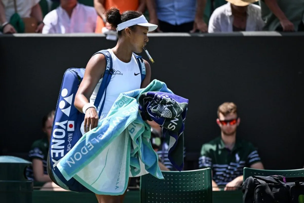 Japan's Naomi Osaka reacts as she leaves the court following her defeat against Russia's Anastasia Pavlyuchenkova at the end of their women's singles third round tennis match on the fifth day of the 2025 Wimbledon Championships at The All England Lawn Tennis and Croquet Club in Wimbledon, southwest London, on July 4, 2025. Kirill KUDRYAVTSEV / AFP
