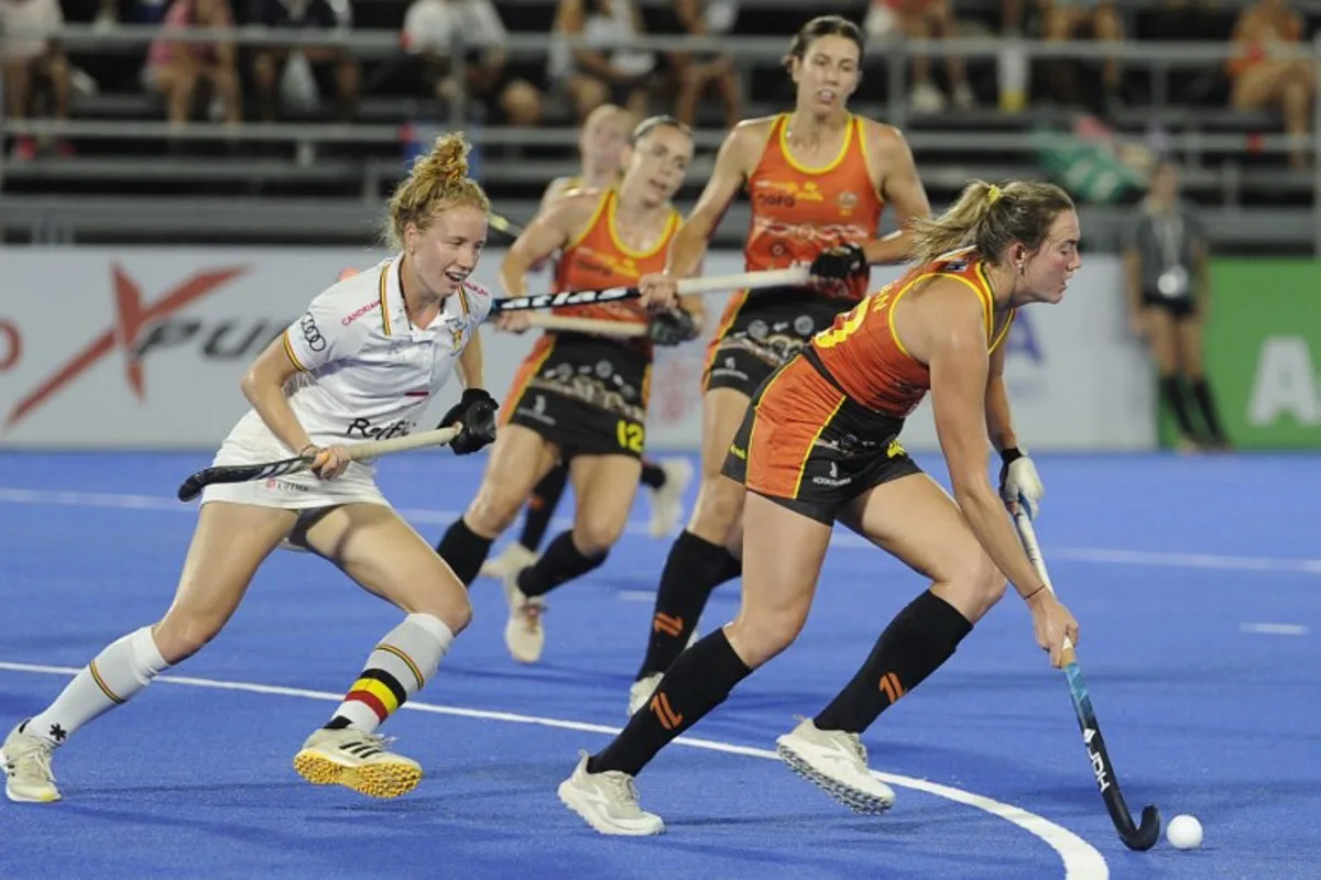 Belgium's Michelle Struijk and Australia's Pippa Morgan fight for the ball during the FIH Pro League women's hockey match between Belgium and Australia in Santiago del Estero, Argentina on February 21, 2025.  Eduardo RAPETTI / AFP