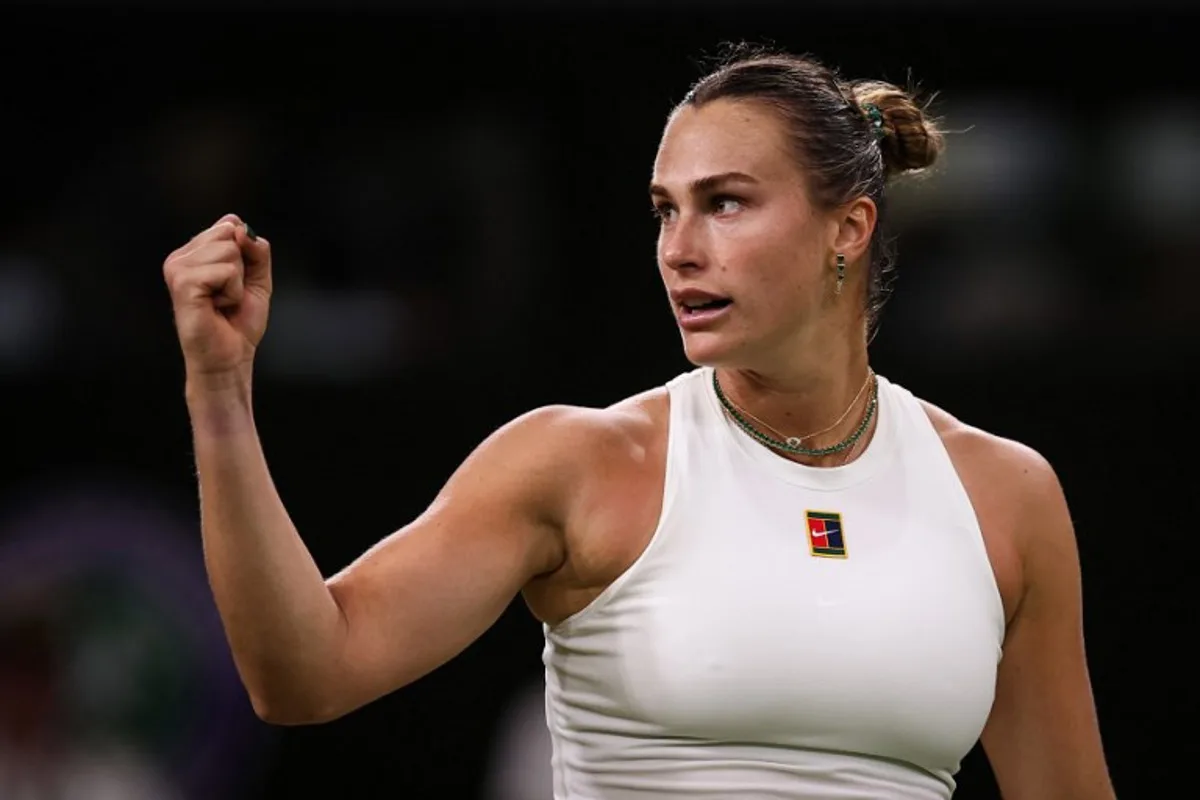 Belarus's Aryna Sabalenka celebrates after winning against Britain's Emma Raducanu during their women's singles third round tennis match on the fifth day of the 2025 Wimbledon Championships at The All England Lawn Tennis and Croquet Club in Wimbledon, southwest London, on July 4, 2025. HENRY NICHOLLS / AFP