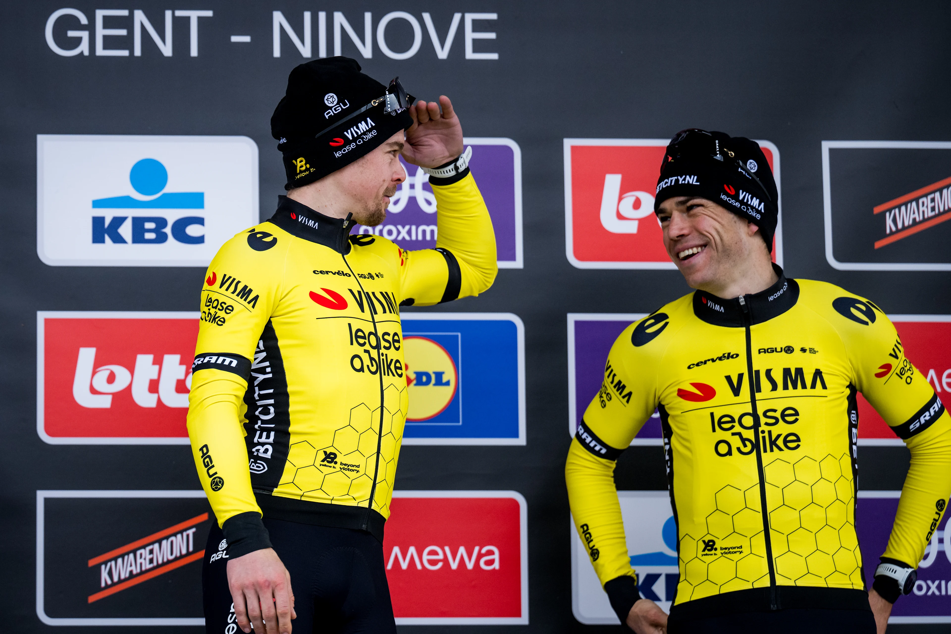 Slovenian Jan Tratnik of Team Visma-Lease a Bike and Belgian Wout van Aert of Team Visma-Lease a Bike celebrate on the podium of the 79th edition of the men's one-day cycling race Omloop Het Nieuwsblad (UCI World Tour), 202km from Gent to Ninove, Saturday 24 February 2024. BELGA PHOTO JASPER JACOBS