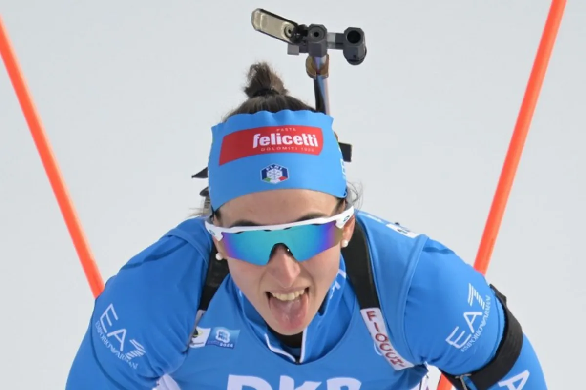 Italy's Lisa Vittozzi reacts after the women's 12,5km mass start event of the IBU Biathlon World Championships in Nove Mesto, Czech Republic on February 18, 2024.  Joe Klamar / AFP