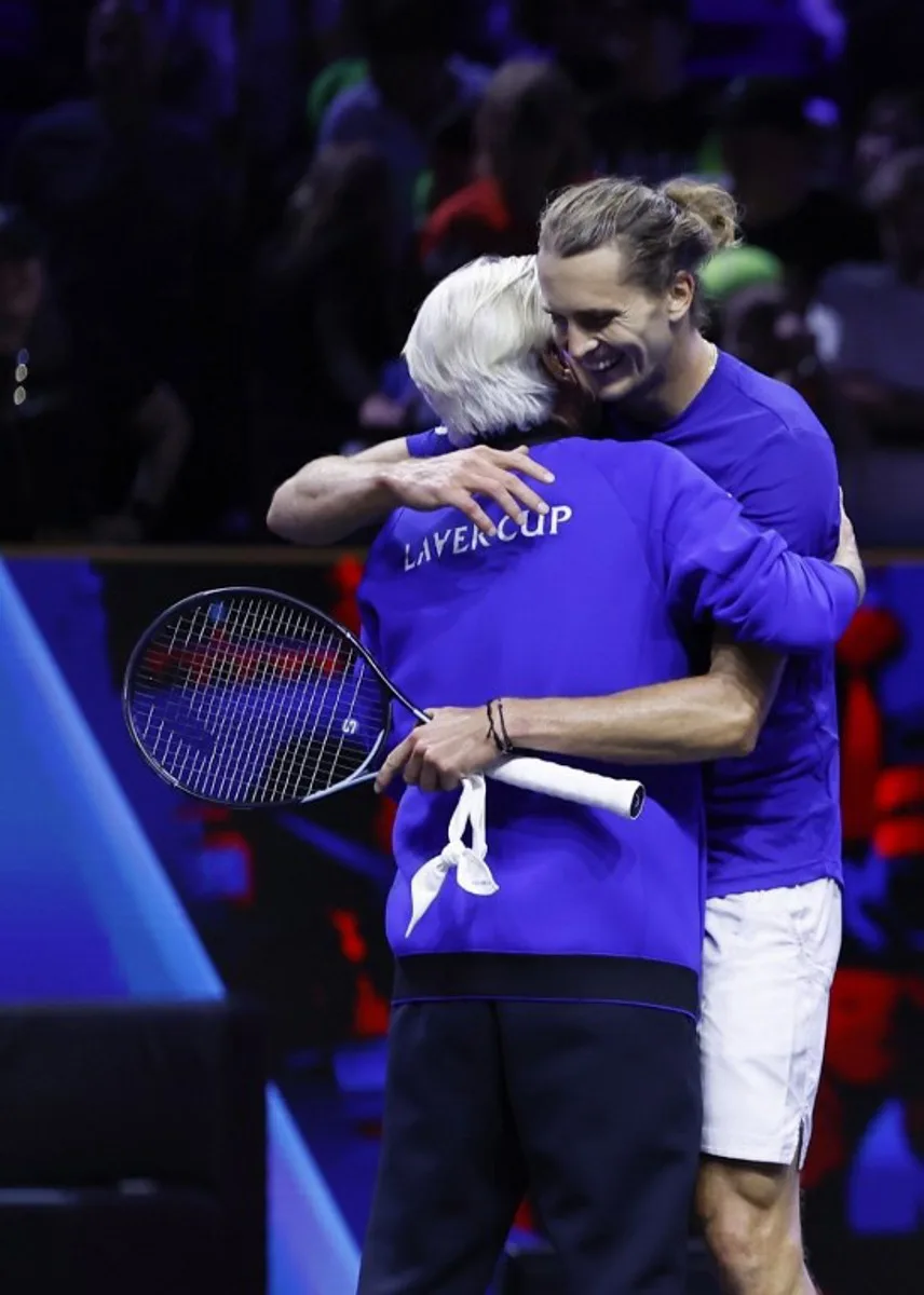 Germany's Alexander Zverev of Team Europe (R) is congratulated by Team Europe's captain Bjorn Borg after winning against USA's Frances Tiafoe of Team World during their 2024 Laver Cup men's singles tennis match in Berlin, Germany on September 22, 2024. Zverev won the match 6-7, 7-5, 10-5. Odd ANDERSEN / AFP