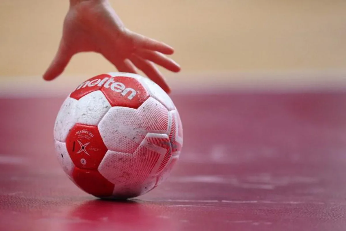 A player grabs the ball during the women's quarterfinal handball match between Sweden and South Korea of the Tokyo 2020 Olympic Games at the Yoyogi National Stadium in Tokyo on August 4, 2021.  Franck FIFE / AFP