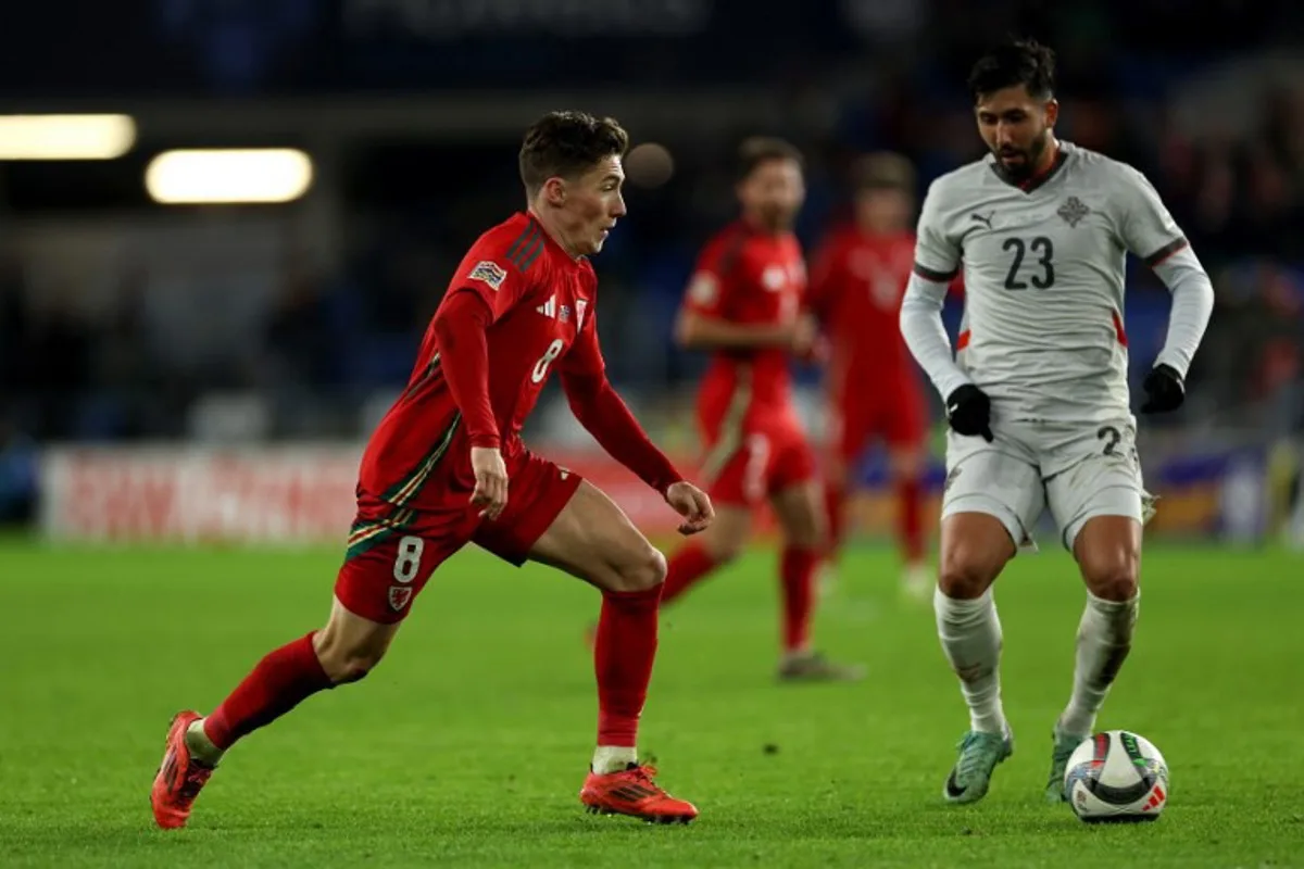 Wales' midfielder #08 Harry Wilson vies for the ball with Iceland's forward #23 Mikael Egill Ellertsson during the UEFA Nations League, League B Group 4 football match between Wales and Iceland, at the Cardiff City Stadium, in Wales, on November 19, 2024.  Adrian Dennis / AFP