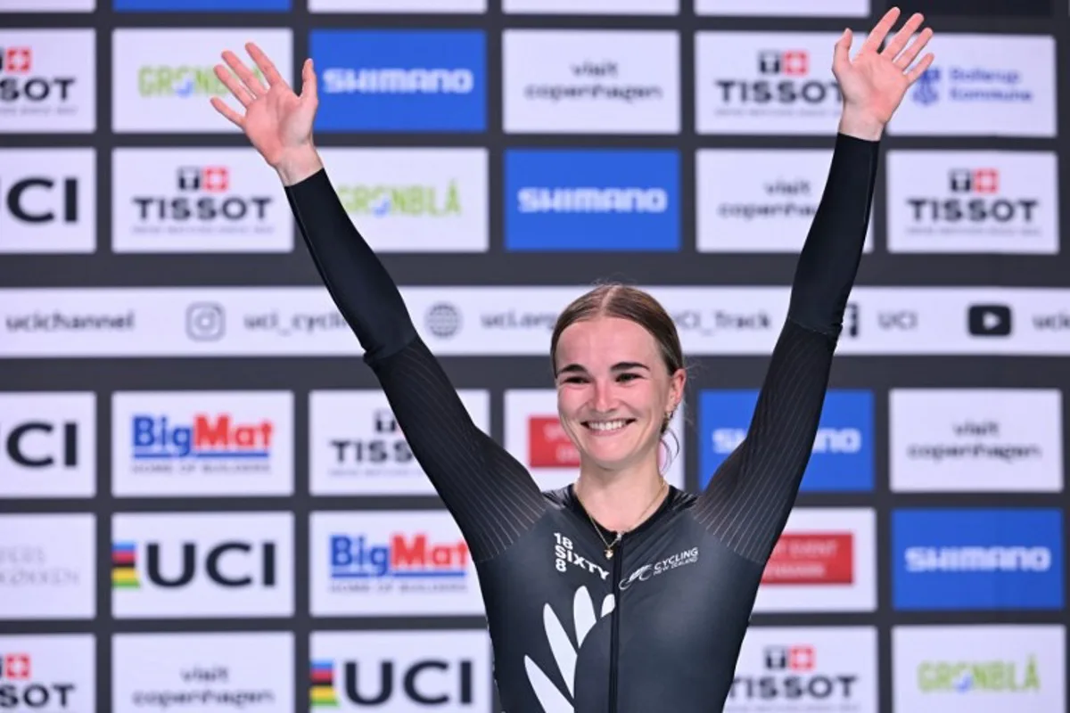 Winner New Zealand's Ally Wollaston celebrates on the podium after the women's elimination race of the UCI Track Cycling World Championships in Ballerup, Denmark, on October 17, 2024.  Jonathan NACKSTRAND / AFP