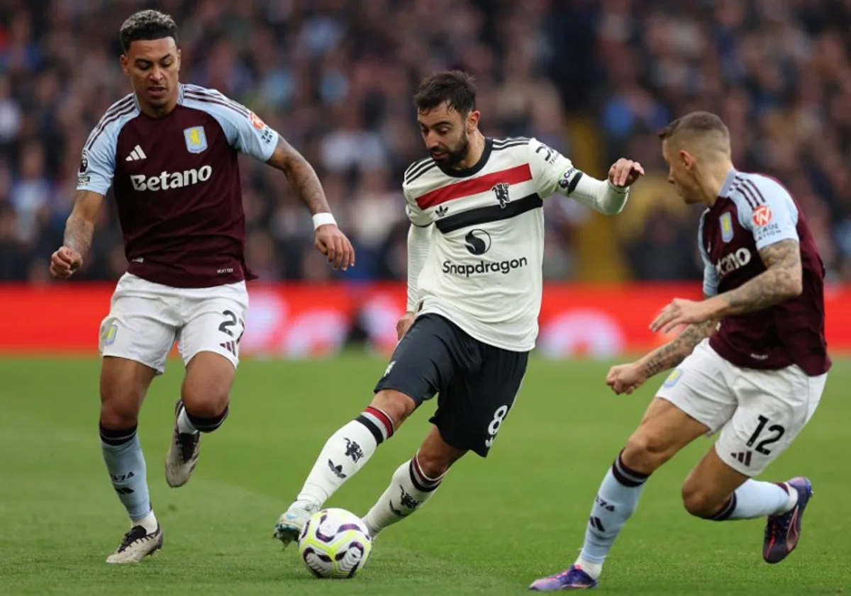 Aston Villa's English midfielder #27 Morgan Rogers (L) and Aston Villa's French defender #12 Lucas Digne (R) vie with Manchester United's Portuguese midfielder #08 Bruno Fernandes during the English Premier League football match between Aston Villa and Manchester United at Villa Park in Birmingham, central England on October 6, 2024.  Adrian Dennis / AFP