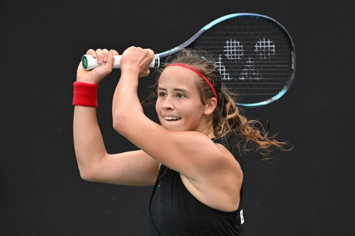 Belgium's Hanne Vandewinkel hits a return to China's Wei Sijia during their women's singles match at the Billie Jean King Cup tennis play-offs at the Guangzhou Nansha International Tennis Center in Guangzhou, in south China's Guangdong province on November 17, 2024.  STR / AFP