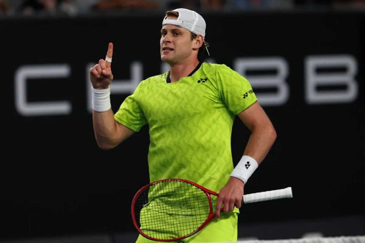 Belgium's Zizou Bergs reacts after a point against Poland's Hubert Hurkacz during their men's singles match on day three of the Australian Open tennis tournament in Melbourne on January 20, 2026.  IZHAR KHAN / AFP