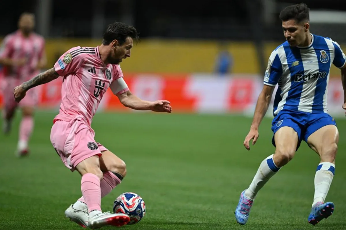 Inter Miami's Argentine forward #10 Lionel Messi (L) fights for the ball with FC Porto's Portuguese defender #74 Francisco Moura during the FIFA Club World Cup 2025 Group A football match between US Inter Miami and Portugal's FC Porto at the Mercedes-Benz stadium in Atlanta on June 19, 2025. Federico PARRA / AFP