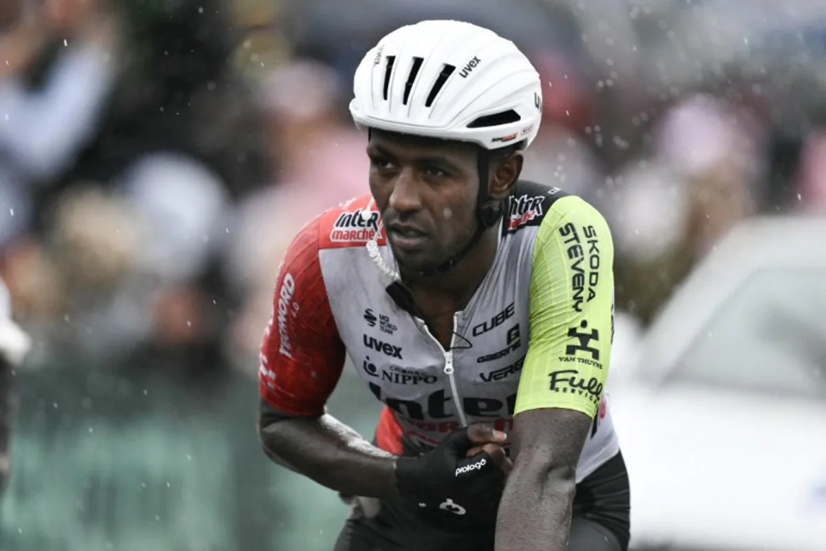 Intermarche - Wanty team's Eritrean rider Biniam Girmay crosses the finish line nursing injuries after a mass crash in the final metres of the 17th stage of the 112th edition of the Tour de France cycling race, 160.4 km between Bollene and Valence, southern France, on July 23, 2025. Marco BERTORELLO / AFP