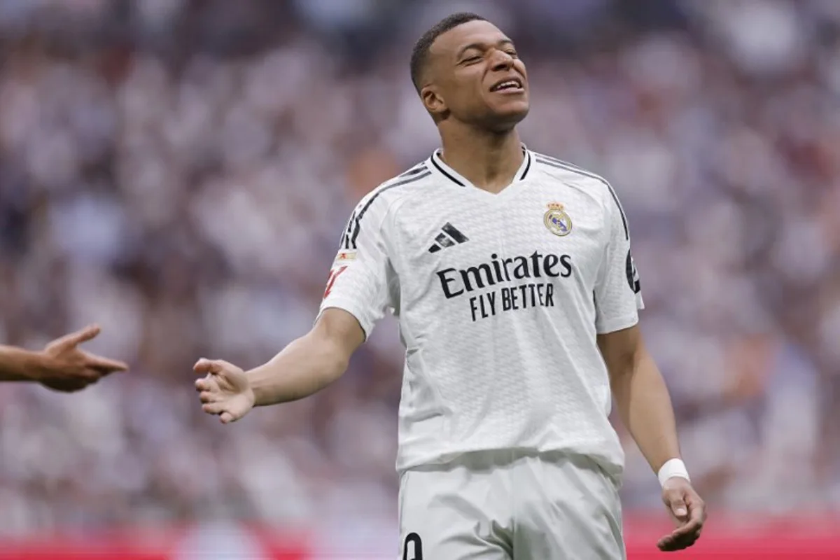 Real Madrid's French forward #09 Kylian Mbappe reacts during the Spanish league football match between Real Madrid CF and Real Sociedad at Santiago Bernabeu Stadium in Madrid on May 24, 2025. OSCAR DEL POZO / AFP