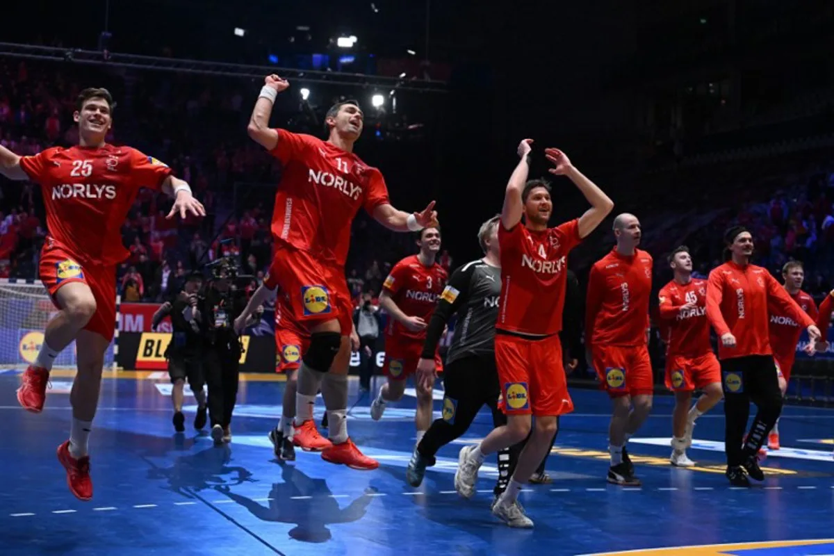 Denmark's players celebrate with their supporters after winning the Men's Handball World Championship semi-final match between Denmark and Portugal in Oslo, Norway on January 31, 2025.  Jonathan NACKSTRAND / AFP