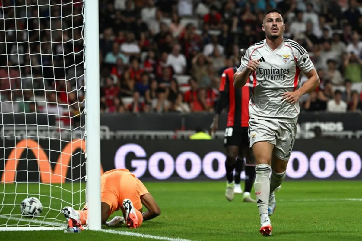 Benfica's Croatian defender #09 Franjo Ivanovic celebrates scoring his team's first goal during the UEFA Champions League 3rd round first leg football match between OGC Nice and SL Benfica at the Allianz Riviera Stadium in Nice, south-eastern, on August 6, 2025. Miguel MEDINA / AFP