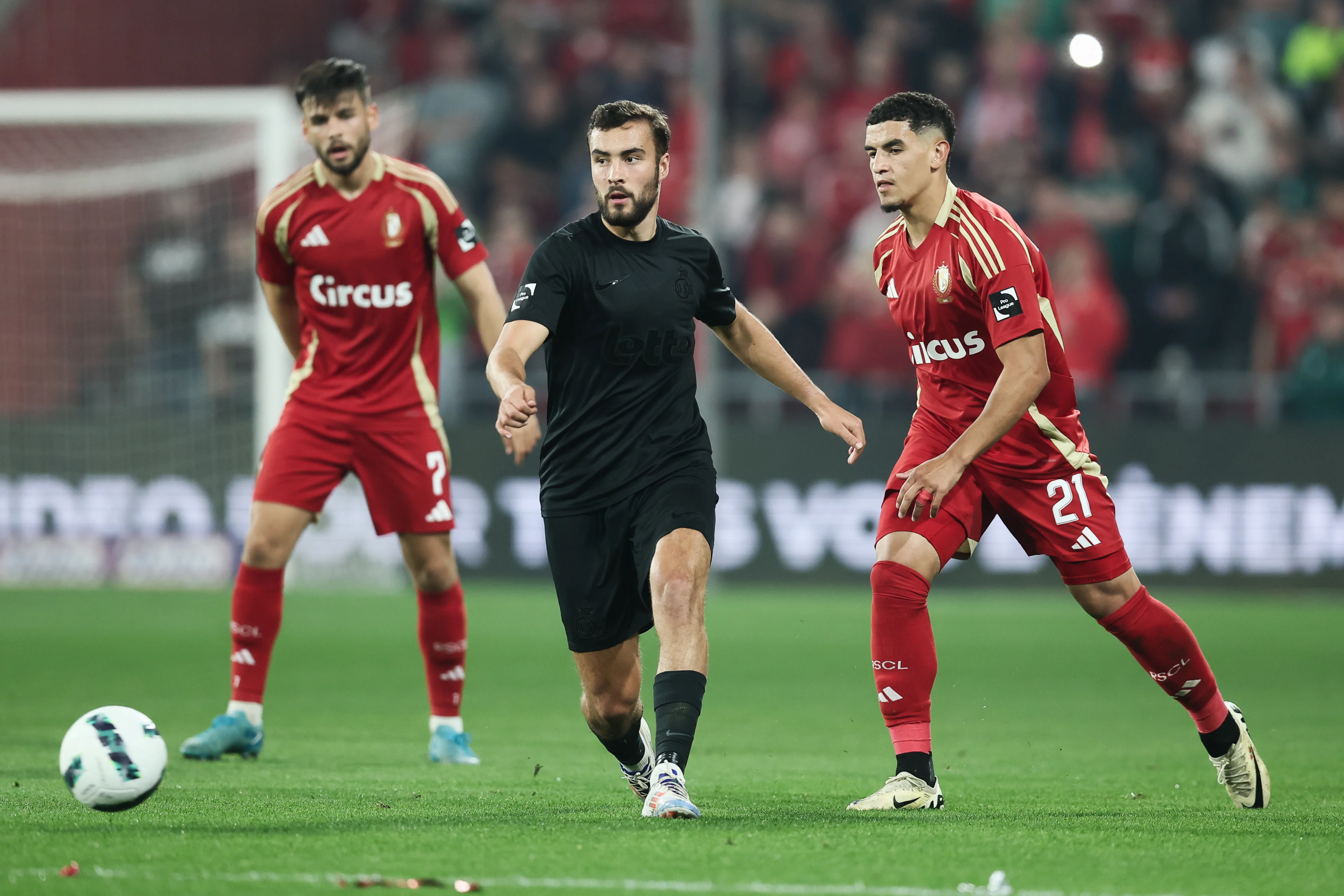 Union's Charles Vanhoutte and Standard's Soufiane Benjdida fight for the ball during a soccer match between Standard Liege and RUSG Royale Union Saint-Gilloise, in Liege, on day 6 of the 2024-2025 season of the 'Jupiler Pro League' first division of the Belgian championship, Friday 20 September 2024. BELGA PHOTO BRUNO FAHY