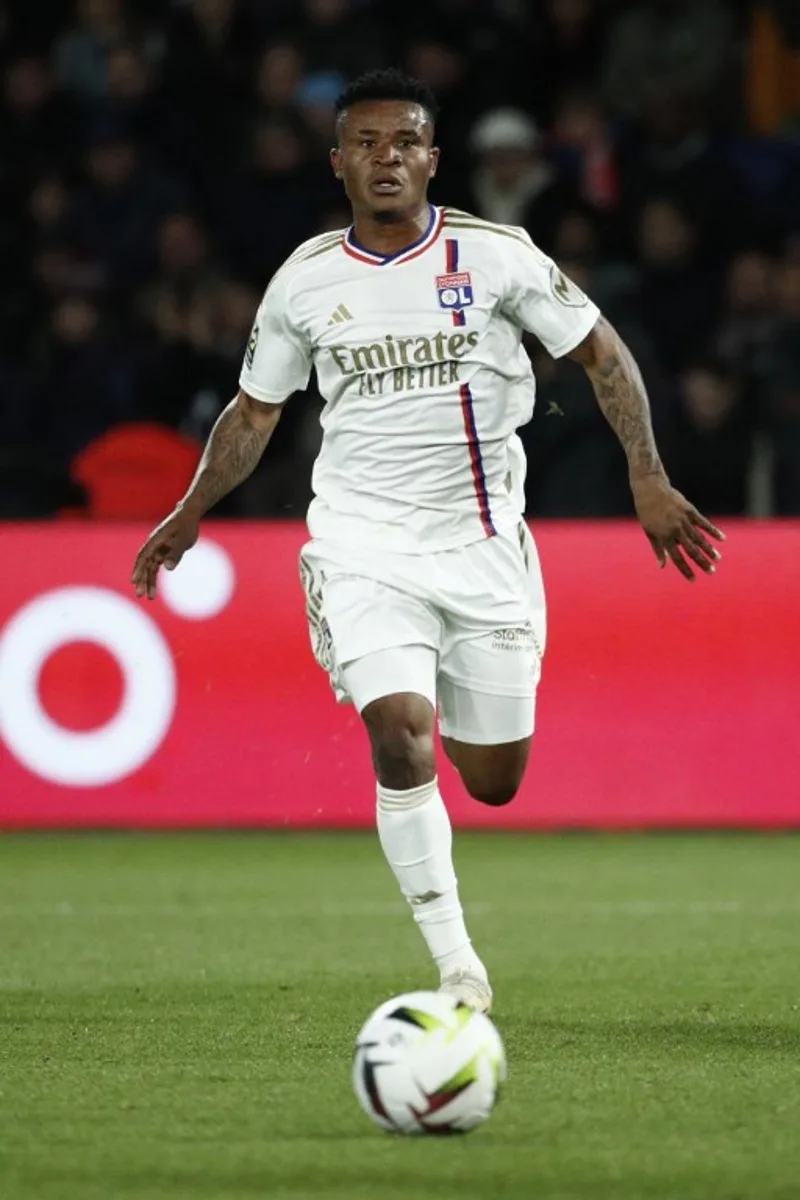 Lyon's Nigerian forward #09 Gift Orban runs with the ball during the French L1 football match between Paris Saint-Germain (PSG) and Olympique Lyonnais (Lyon) at the Parc des Princes stadium in Paris on April 21, 2024.  Guillaume BAPTISTE / AFP