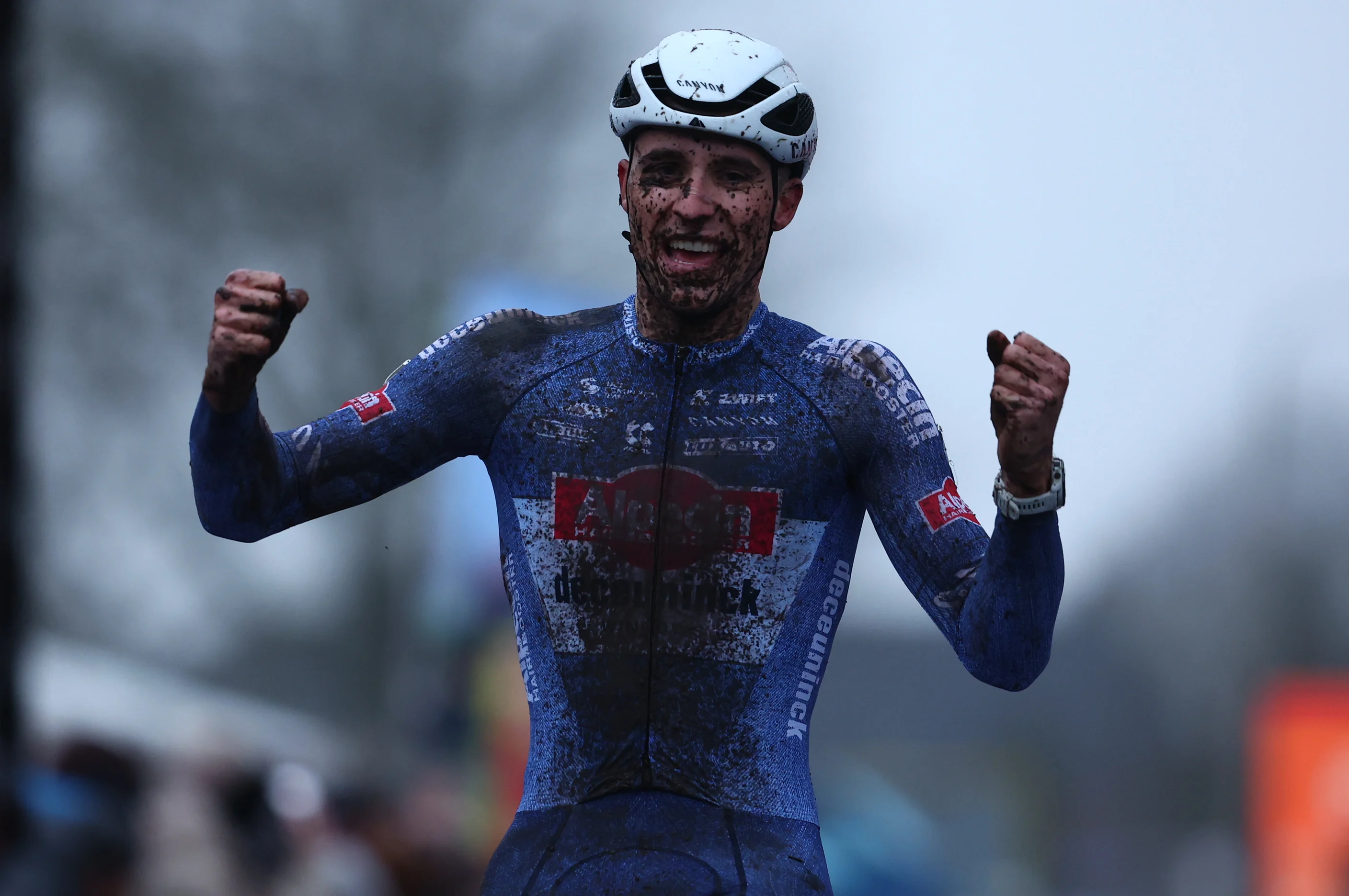 Belgian Niels Vandeputte celebrates as he crosses the finish line to win the men's elite race of the World Cup cyclocross cycling event in Hulst, the Netherlands, stage 5 (out of 12) of the UCI World Cup cyclocross competition, Saturday 21 December 2024. BELGA PHOTO DAVID PINTENS