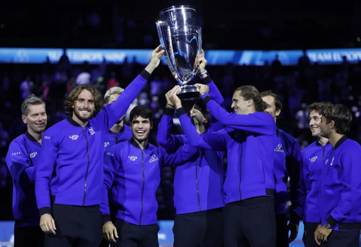 Greece's Stefanos Tsitsipas (2L), Spain's Carlos Alcaraz (3L), Germany's Alexander Zverev (4R) and other players of Team Europe celebrate with the trophy during the awarding ceremony at the end of the 2024 Laver Cup tennis tournament in Berlin, Germany on September 22, 2024. Spain's Carlos Alcaraz won the last match of the tournament 6-2, 7-5 against USA's Taylor Fritz of Team World. Team Europe won 13-11 against Team World.  Odd ANDERSEN / AFP