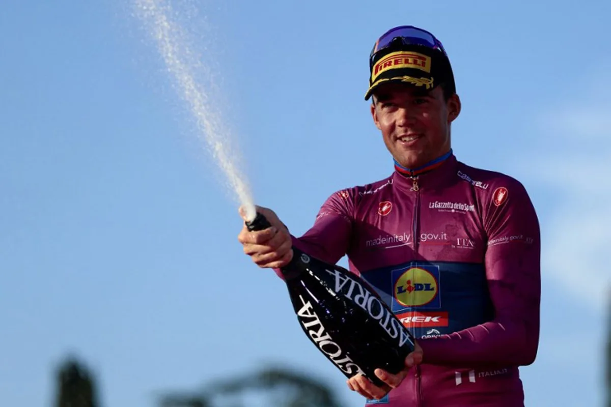 Lidl-Trek's Danish rider Mads Pedersen wearing the cyclamen jersey of best sprinter (Maglia Ciclamino) celebrates on the podium after the 21st and last stage of the 108th Giro d'Italia cycling race of 143kms from Rome to Rome on June 1, 2025. Luca Bettini / AFP
