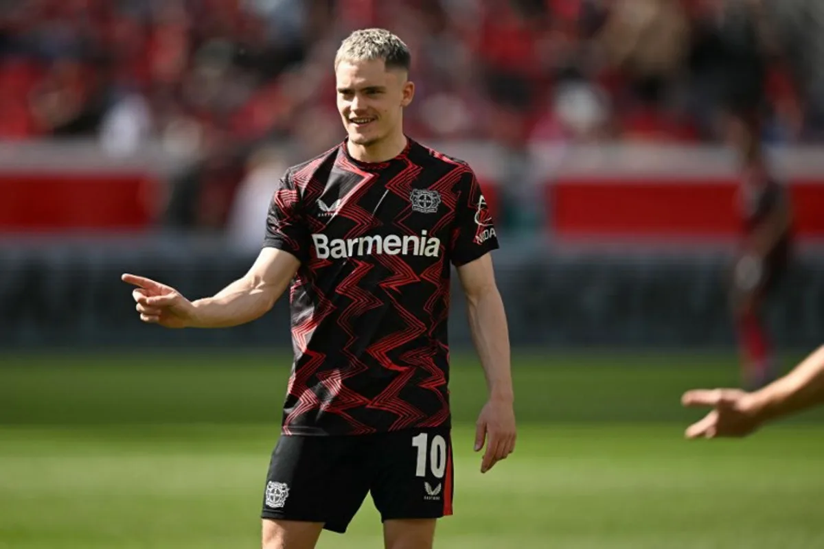 Bayer Leverkusen's German midfielder #10 Florian Wirtz warms up prior to the German first division Bundesliga football match between Bayer Leverkusen and Union Berlin in Leverkusen, western Germany, on April 12, 2025. INA FASSBENDER / AFP