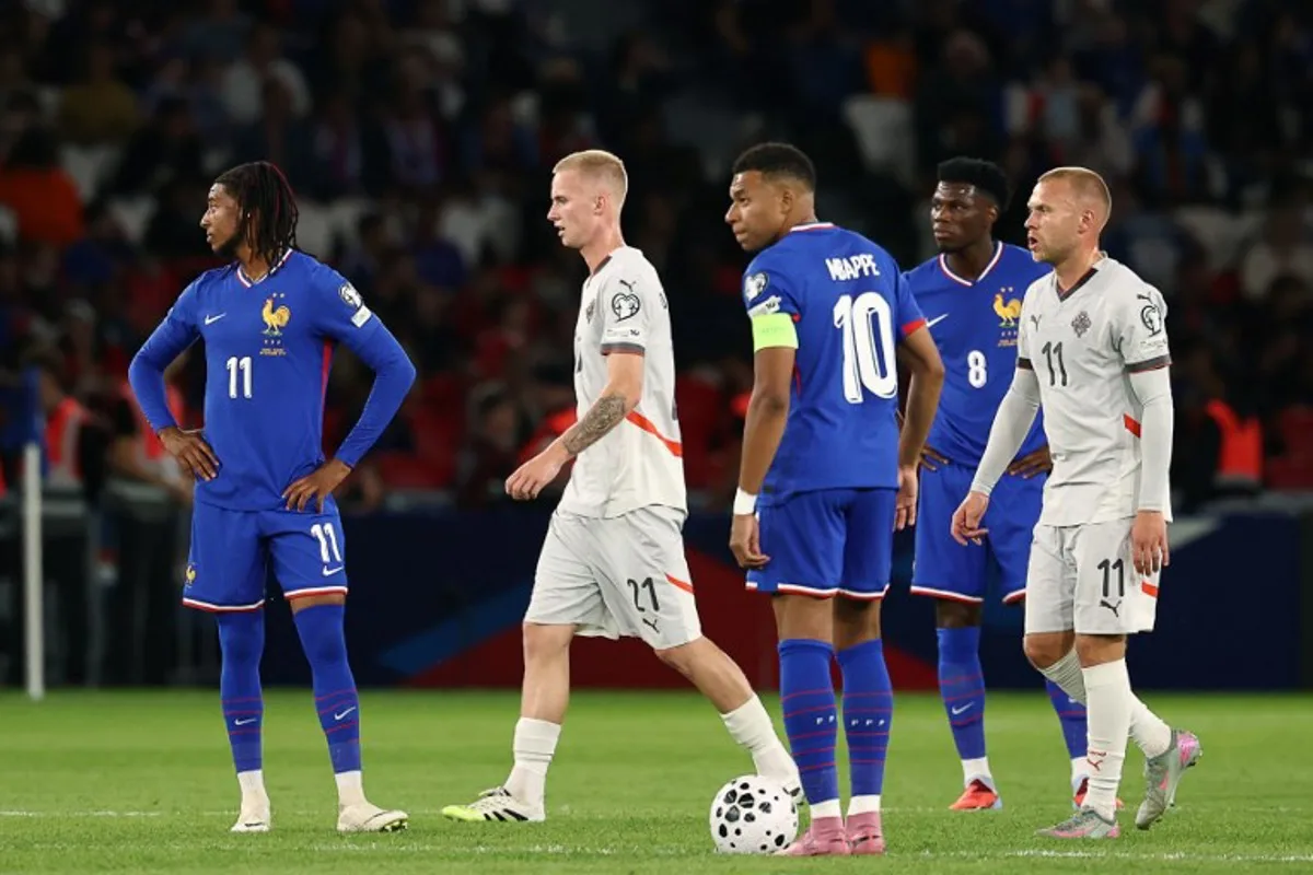 Iceland's forward #21 Daniel Gudjohnsen (2nd L) and Iceland's midfielder #11 Jon Dagur Thorsteinsson (R) reacts next to France's forward #11 Michael Olise (L), France's forward #10 Kylian Mbappe (C) and France's midfielder #08 Aurelien Tchouameni (2nd R) after Iceland scored the opening goal during the FIFA World Cup 2026 Group D European qualification football match between France and Iceland at the Parc des Princes stadium in Paris, on September 9, 2025. FRANCK FIFE / AFP