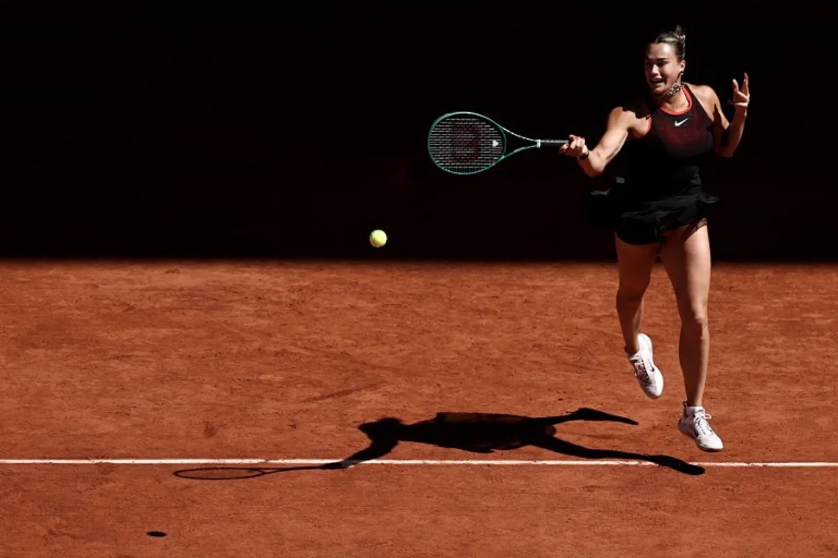 Belarus' Aryna Sabalenka plays a forehand return to Spain's Jessica Bouzas Maneiro during their women's singles match on day 3 of the French Open tennis tournament on Court Philippe-Chatrier at the Roland-Garros Complex in Paris on May 26, 2026. Anne-Christine POUJOULAT / AFP