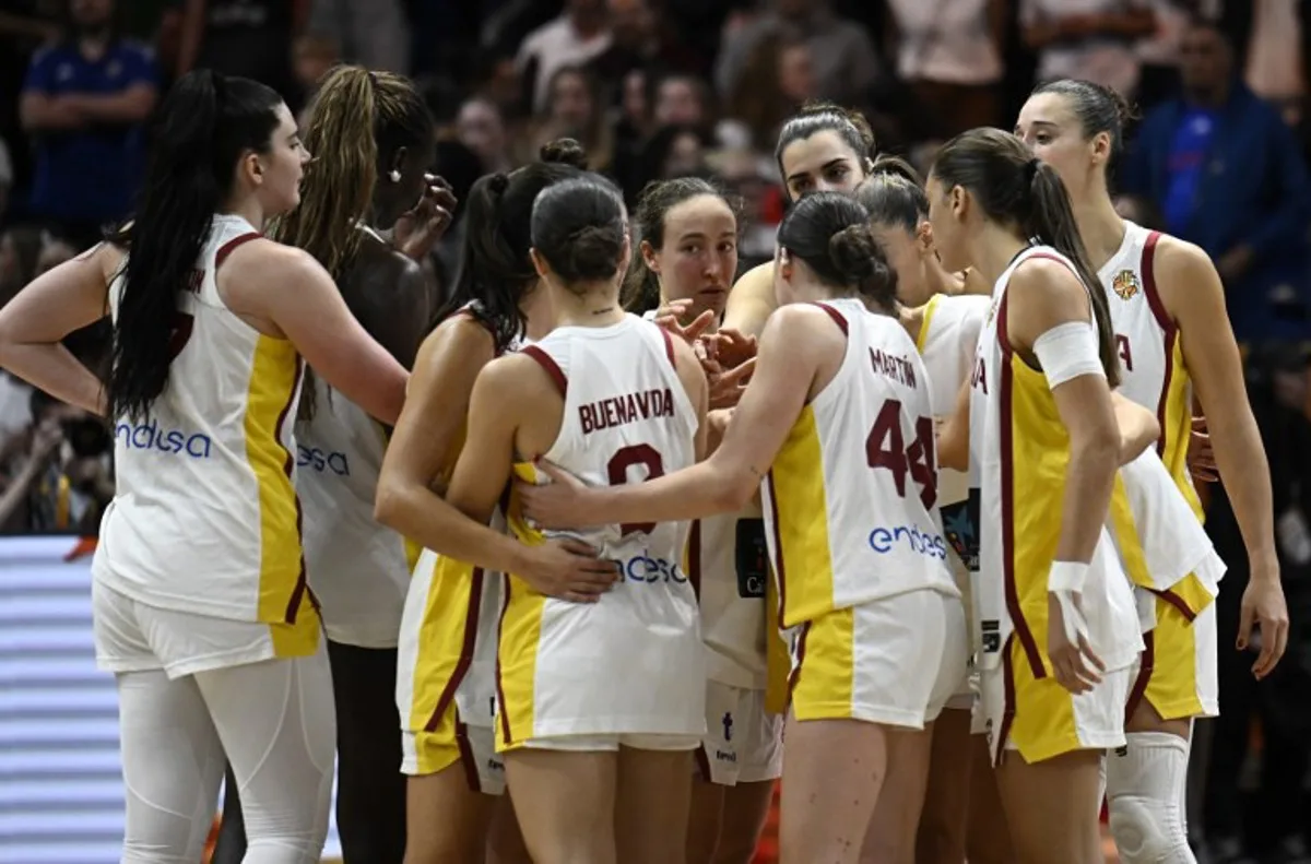 Players gather together during the 2026 FIBA Women's Basketball World Cup semi-final match between Spain and the United States in Berlin on September 12, 2026. Tobias SCHWARZ / AFP