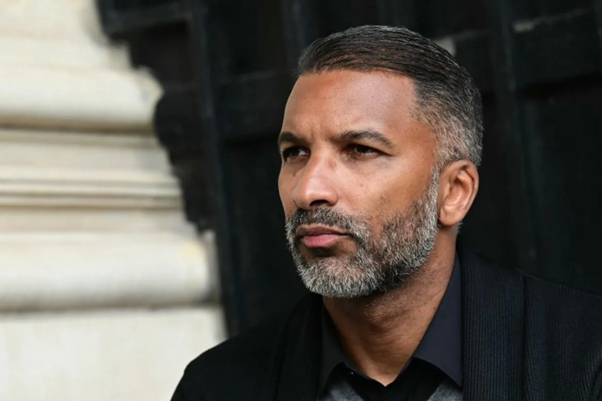 Former football player and current Red Star FC manager Habib Beye speaks to journalists ahead of a the gala dinner marking the 15th anniversary of the Diomede Academy, at the Hotel Crillon in Paris, on May 27, 2024.  Miguel MEDINA / AFP