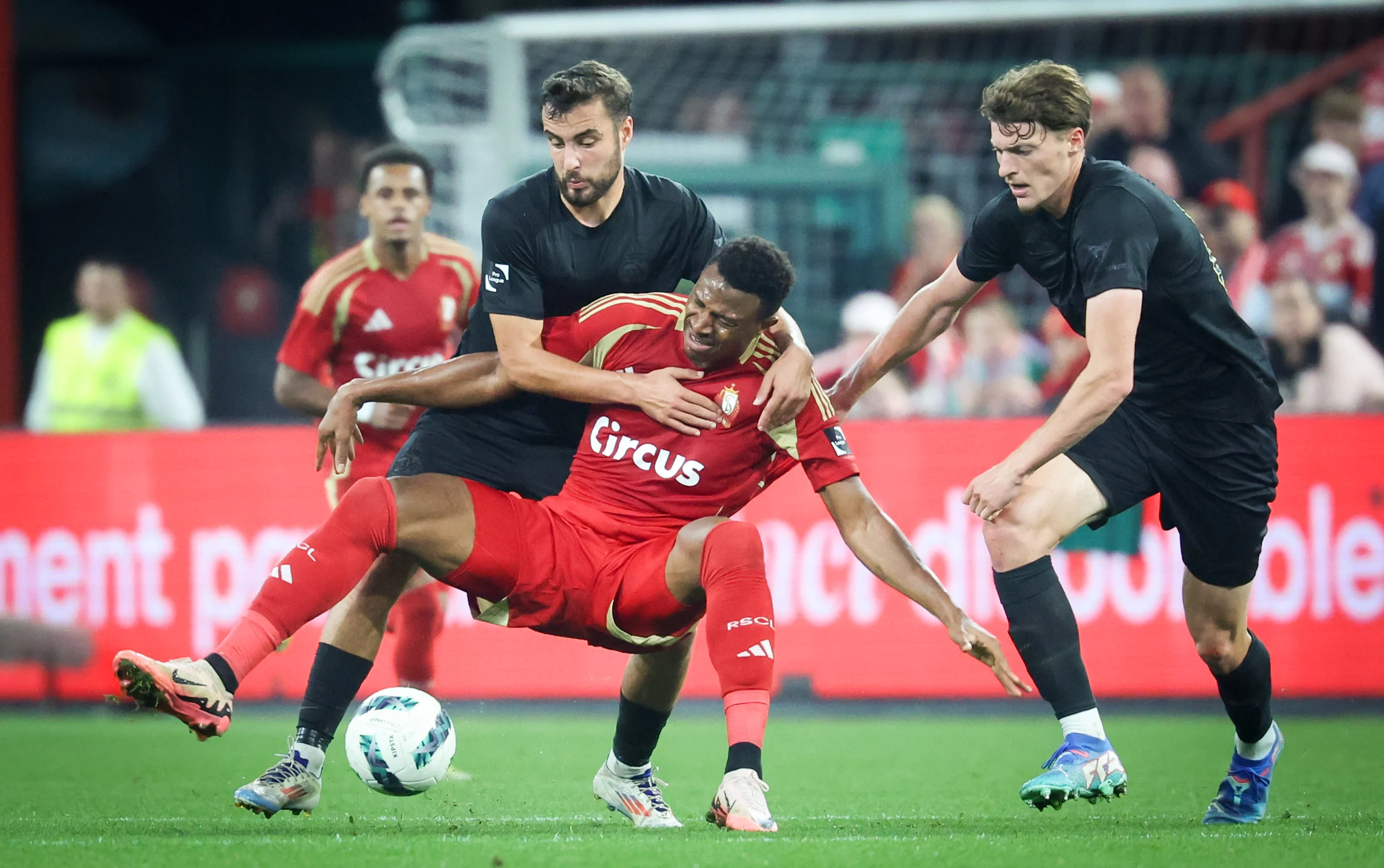 Union's Charles Vanhoutte and Standard's Muhammed Badamosi fight for the ball during a soccer match between Standard Liege and RUSG Royale Union Saint-Gilloise, in Liege, on day 6 of the 2024-2025 season of the 'Jupiler Pro League' first division of the Belgian championship, Friday 20 September 2024. BELGA PHOTO VIRGINIE LEFOUR