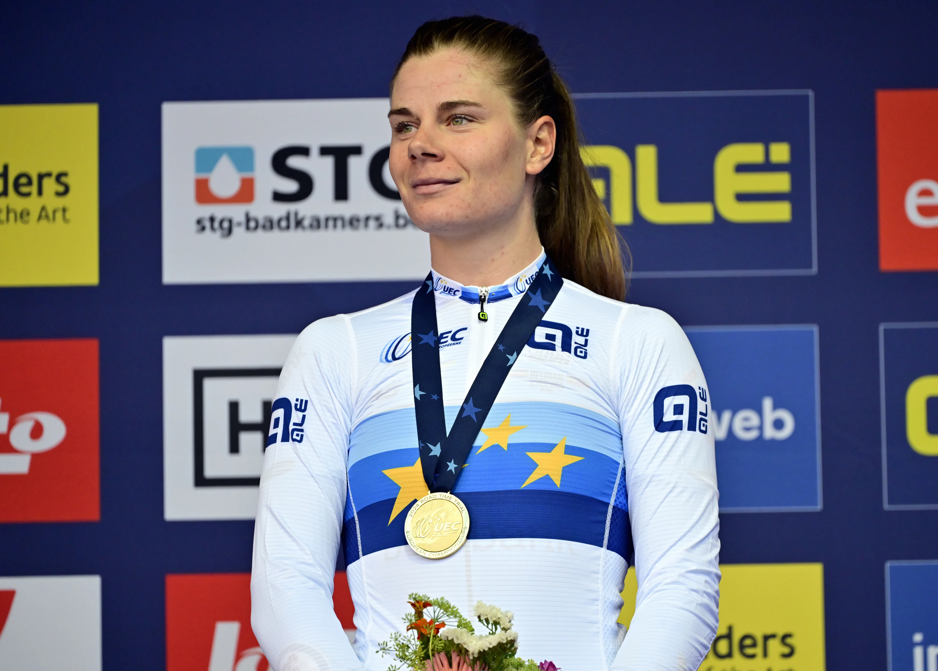 Belgian Lotte Kopecky celebrates on the podium after winning the time trial Elite Women at the European Championship 2024, in Hasselt, Wednesday 11 September 2024. The UEC Road European Championships 2024 will take place from 11 to 15 september in Limburg, Belgium. BELGA PHOTO DIRK WAEM