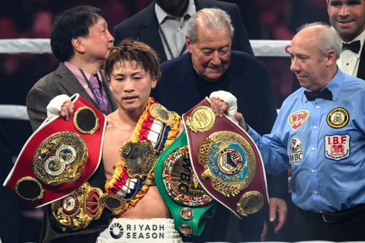 Japan's Naoya Inoue celebrates his victory against South Korea's Kim Ye-joon during their world super-bantamweight title boxing bout in Tokyo on January 24, 2025.  Philip FONG / AFP