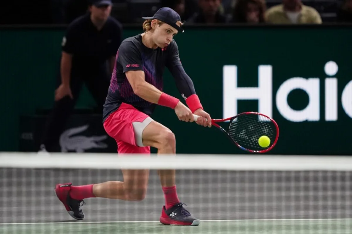 Belgium's Zizou Bergs plays a backhand return to France's Richard Gasquet during their men's singles match on day two of the Paris ATP Masters 1000 tennis tournament at the Accor Arena - Palais Omnisports de Paris-Bercy - in Paris on October 29, 2024.  Dimitar DILKOFF / AFP