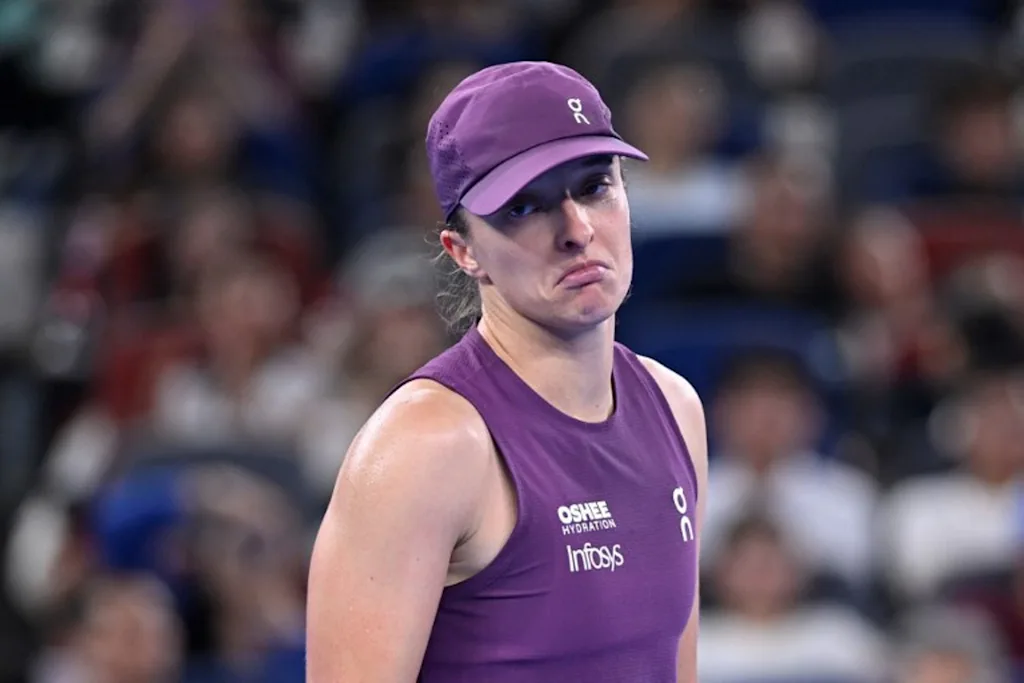 Poland's Iga Swiatek reacts after a point during her women's singles semi-final match against Poland's Maja Chwalinska at the Wuhan Open tennis tournament in Wuhan, China's Hubei province on October 17, 2026.   WANG Zhao / AFP