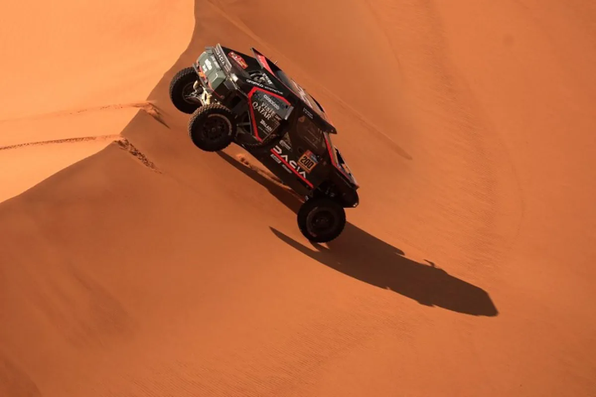 Qatari driver Nasser Al-Attiyah and French co-driver Edouard Boulanger compete during Stage 8 of the Dakar Rally 2025, between Al Duwadimi and Riyadh, Saudi Arabia, on January 13, 2025.  Valery HACHE / AFP