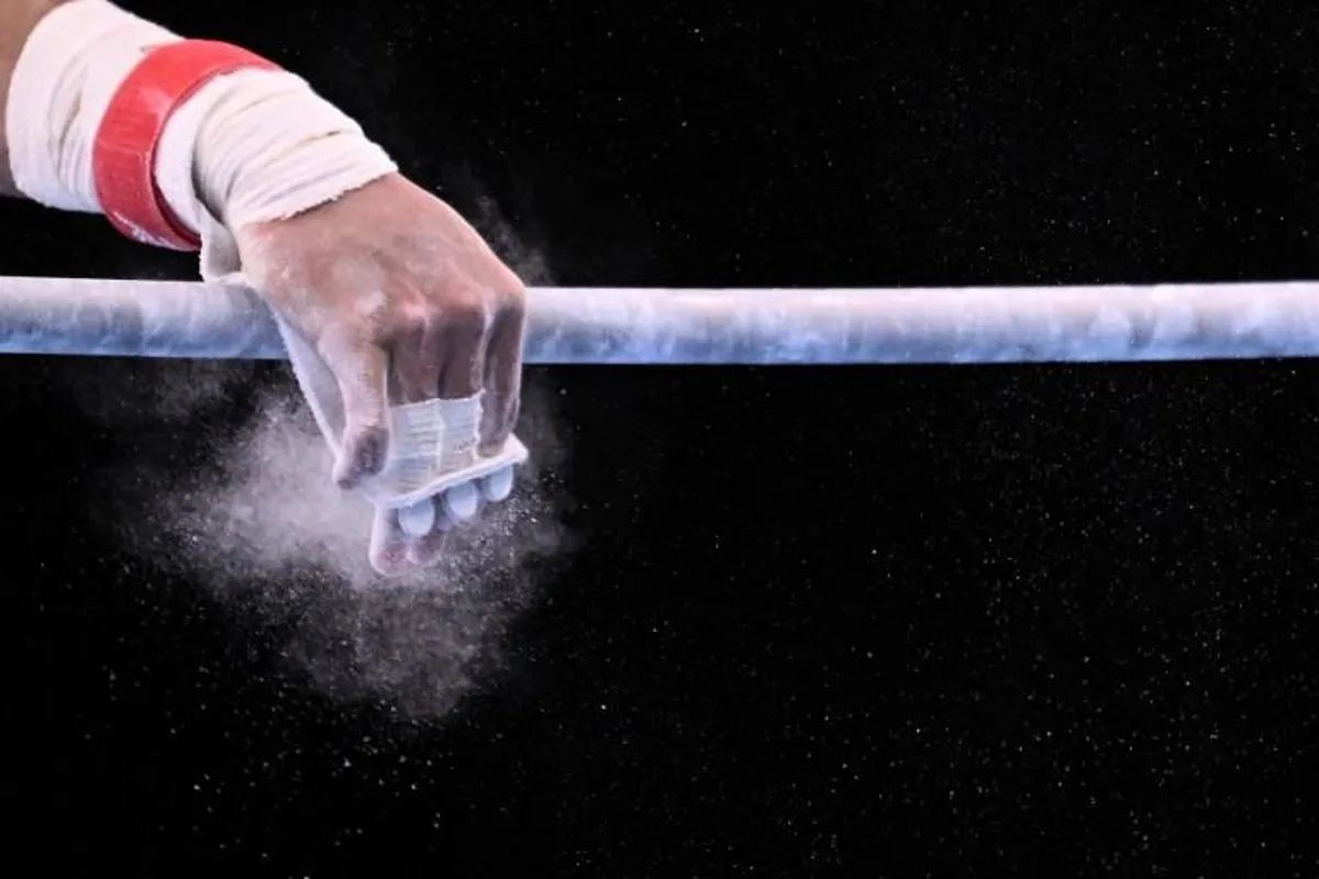 Chinese Taipei's Chih Kai Lee competes in the horizontal bar event of the artistic gymnastics men's all-around final during the Tokyo 2020 Olympic Games at the Ariake Gymnastics Centre in Tokyo on July 28, 2021. Lionel BONAVENTURE / AFP