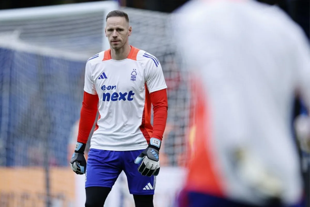 Nottingham Forest's Belgian goalkeeper #26 Matz Sels warms up ahead of the English Premier League football match between Chelsea and Nottingham Forest at Stamford Bridge in London on October 6, 2024.  BENJAMIN CREMEL / AFP